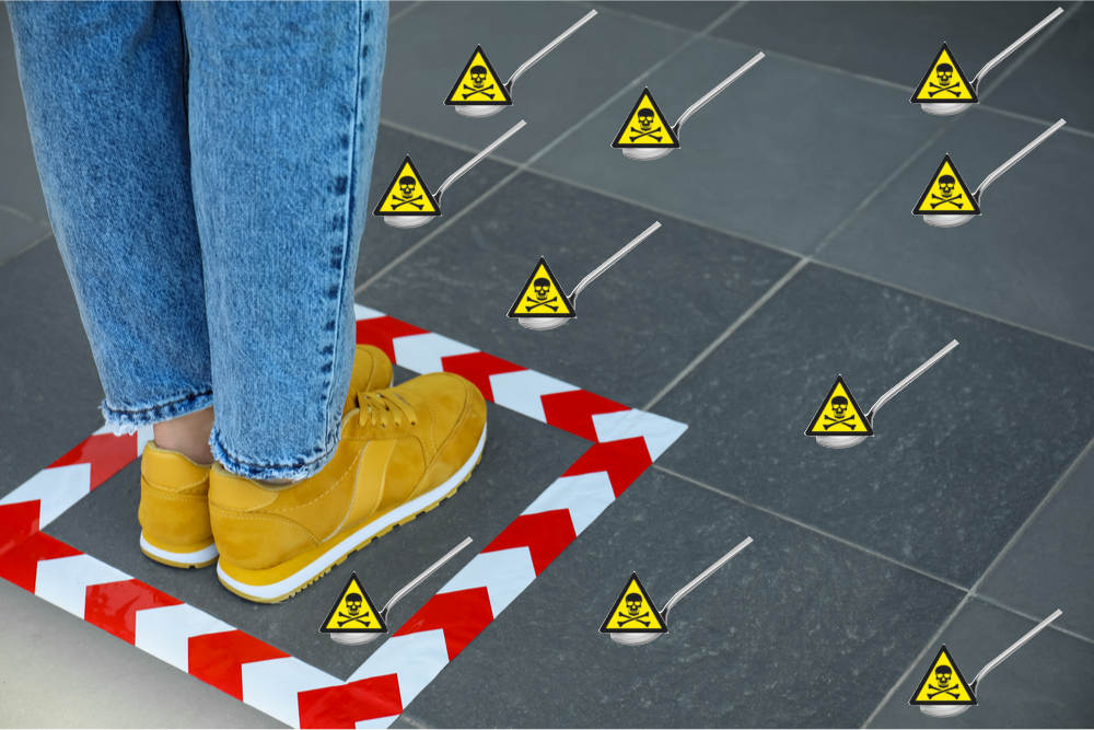Woman Surrounded by Hazardous Waste